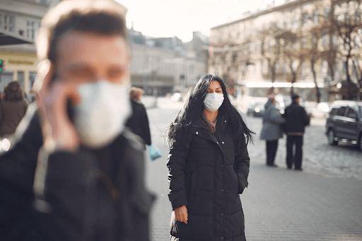 how coronavirus spreads people wearing masks