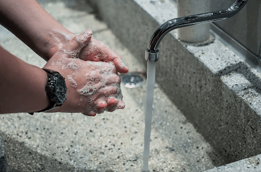 why soap and water kills the coronavirus man washing hands thoroughly